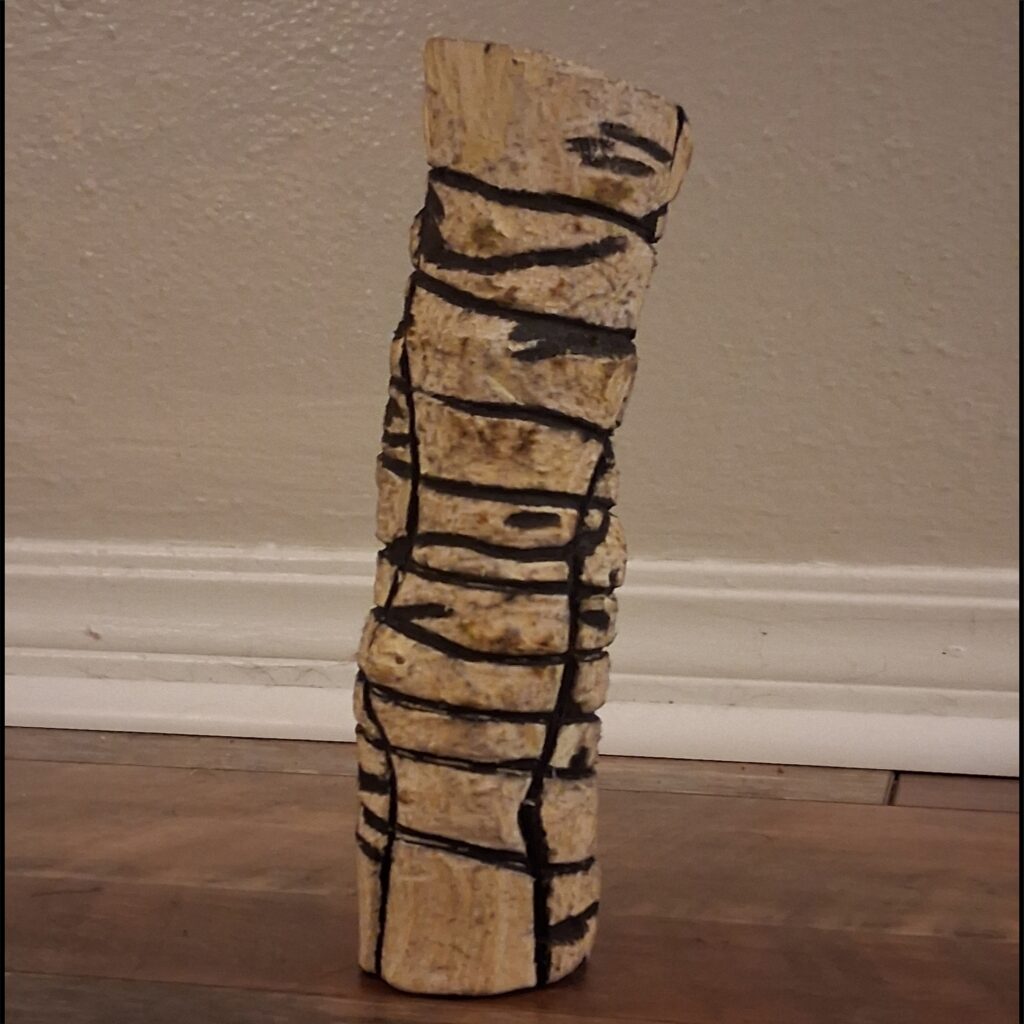 Natural wood with black abstract sculpture lines